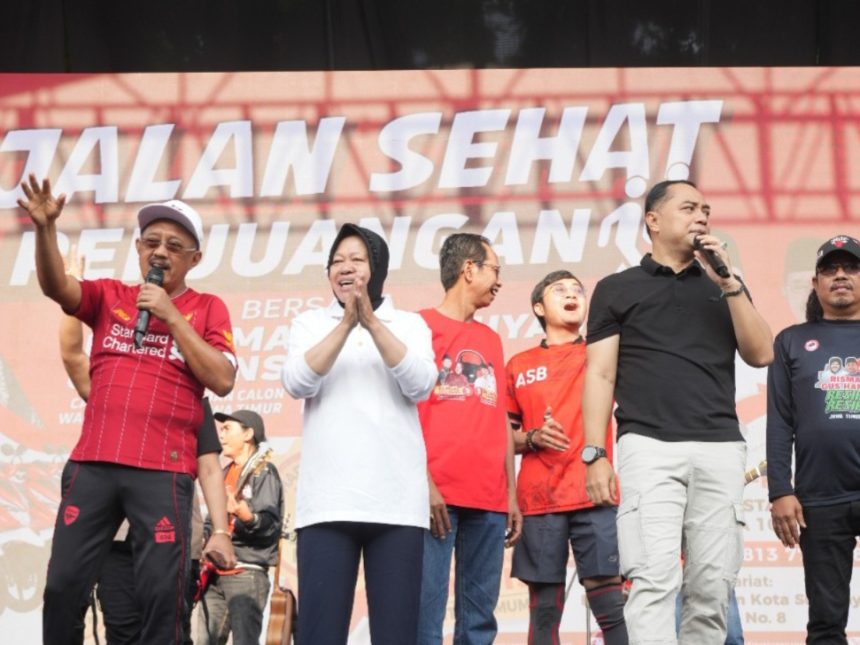 Calon Wakil Wali Kota Surabaya, Armuji, Cagub Risma dan Calon Wali Kota Surabaya Eri Cahyadi menyapa warga Surabaya di acara Jalan sehat di depan Gelora 10 November Surabaya, Jalan Tambaksari.